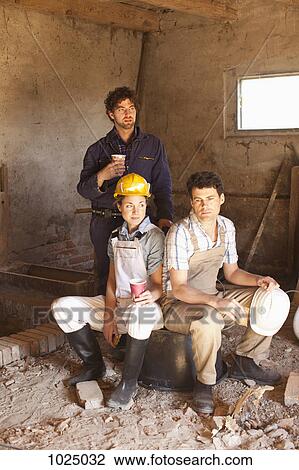 Three construction workers on their lunch break View Large Photo Image Stock Image - Three construction workers on their lunch break. Fotosearch