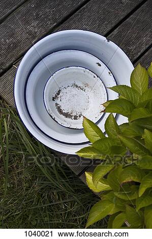 Three different sized old-fashioned enamel wash basins View Large Photo Image Stock Image - Three different sized old-fashioned enamel wash basins . Fotosearch