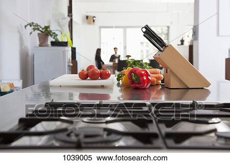 Tomatoes, carrots and bell peppers on a kitchen counter View Large Photo Image Stock Photography - Tomatoes, carrots and bell peppers on a kitchen counter. Fotosearch
