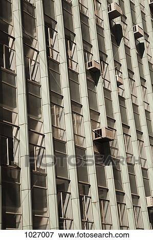 Tower block showing windows and air conditioners View Large Photo Image Stock Photo - Tower block showing windows and air conditioners. Fotosearch