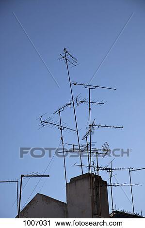 TV antennas on rooftops View Large Photo Image Stock Image - TV antennas on rooftops. Fotosearch