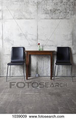 Two chairs and a table View Large Photo Image Stock Photo - Two chairs and a table. Fotosearch