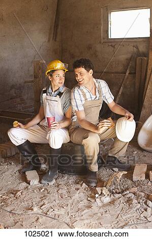 Two construction workers on their lunch break View Large Photo Image Stock Image - Two construction workers on their lunch break. Fotosearch