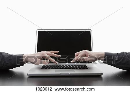 Two hands typing on one laptop keyboard, digital composite View Large Photo Image Stock Image - Two hands typing on one laptop keyboard, digital composite. Fotosearch
