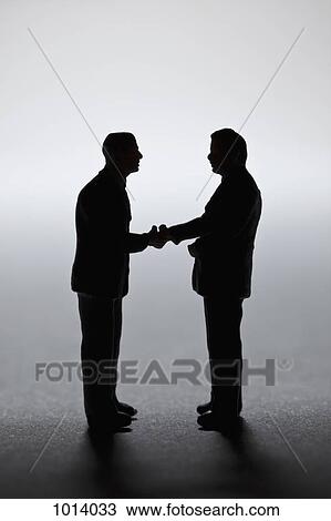 Two miniature businessmen figurines shaking hands View Large Photo Image Stock Image - Two miniature businessmen figurines shaking hands. Fotosearch