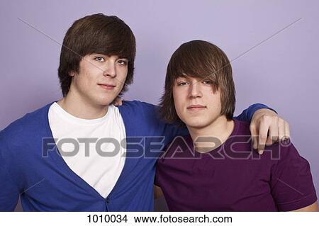 Picture - Two teenage boys, portrait, studio shot. Fotosearch
