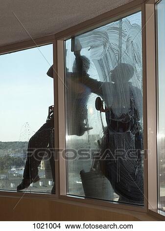 Two window washers at work View Large Photo Image Picture - Two window washers at work. Fotosearch