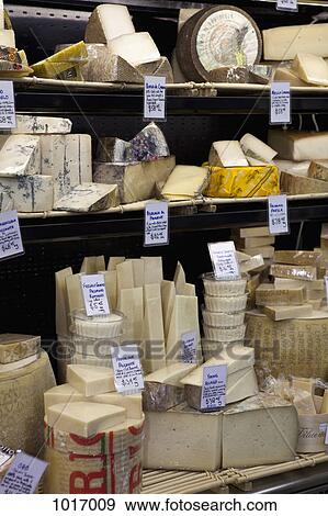 Various cheeses at a market stall View Large Photo Image Stock Photo - Various cheeses at a market stall. Fotosearch