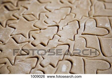 Various shaped cookies in dough View Large Photo Image Stock Photograph - Various shaped cookies in dough. Fotosearch