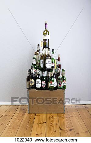 Various wine and beer bottles stacked into a pyramid shape View Large Photo Image Stock Image - Various wine and beer bottles stacked into a pyramid shape. Fotosearch