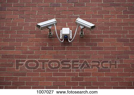 Video surveillance cameras on a wall View Large Photo Image Stock Photo - Video surveillance cameras on a wall. Fotosearch