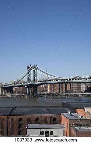 View over buildings with Williamsburg Bridge in the distance View Large Photo Image Stock Image - View over buildings with Williamsburg Bridge in the distance . Fotosearch