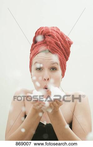 Woman in towel blowing bubbles View Large Photo Image Stock Photo - Woman in towel blowing bubbles. Fotosearch