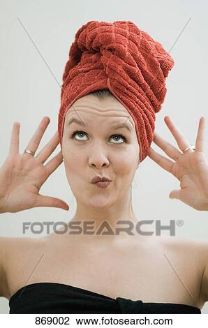 Woman in towel quirky face View Large Photo Image Stock Image - Woman in towel quirky face. Fotosearch
