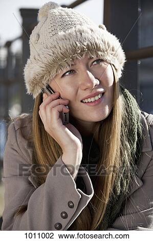 Woman outside on phone View Large Photo Image Stock Image - Woman outside on phone. Fotosearch
