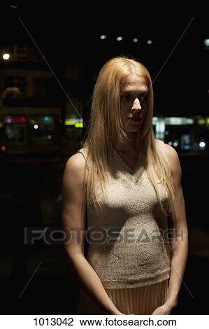 Woman standing up looking mysterious and staring away. View Large Photo Image Stock Image - Woman standing up looking mysterious and staring away.. Fotosearch