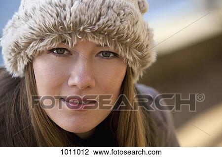 Stock Image - Woman with hat profile pose. Fotosearch
