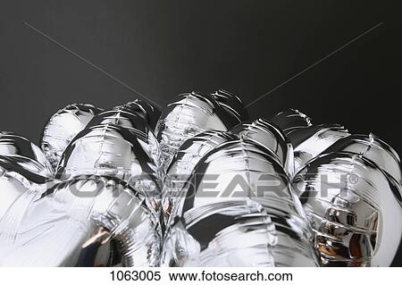 A bunch of silver helium balloons View Large Photo Image Stock Photography - A bunch of silver helium balloons . Fotosearch