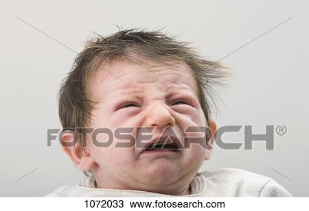 A crying newborn baby View Large Photo Image Stock Image - A crying newborn baby. Fotosearch