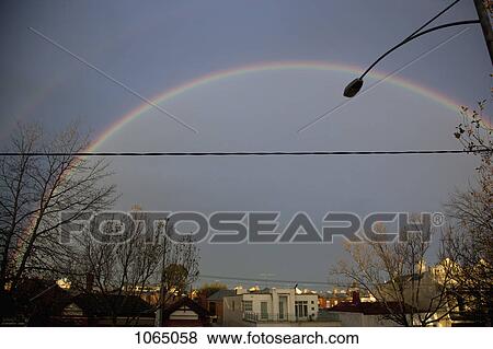 Stock Photo - A double rainbow over a city. Fotosearch