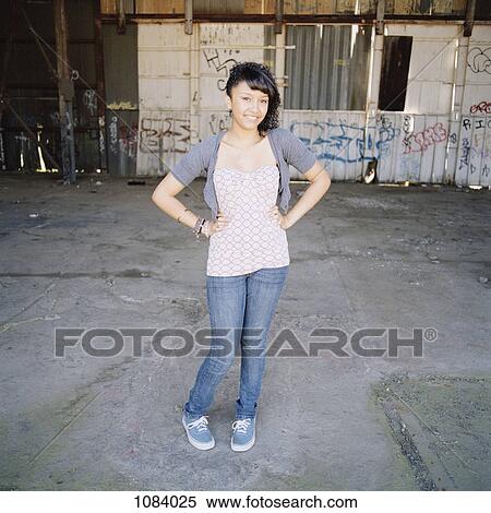 A fashionable teenage girl posing in an urban setting View Large Photo Image Stock Photography - A fashionable teenage girl posing in an urban setting. Fotosearch