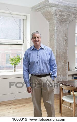 A mature man smiling at the camera View Large Photo Image Stock Photography - A mature man smiling at the camera. Fotosearch