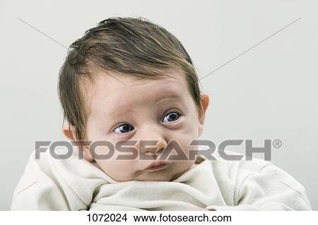 A newborn baby looking contemplative View Large Photo Image Picture - A newborn baby looking contemplative. Fotosearch