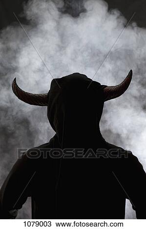 A person with horns attached to head, silhouette View Large Photo Image Stock Image - A person with horns attached to head, silhouette. Fotosearch