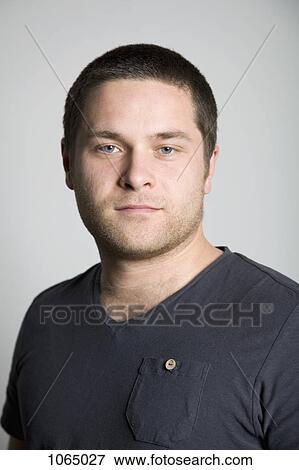 A serious young man, portrait, head and shoulders View Large Photo Image Stock Photo - A serious young man, portrait, head and shoulders. Fotosearch