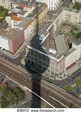 A shadow of the Berliner Fernsehturm over cityscape View Large Photo Image Stock Image - A shadow of the Berliner Fernsehturm over cityscape. Fotosearch