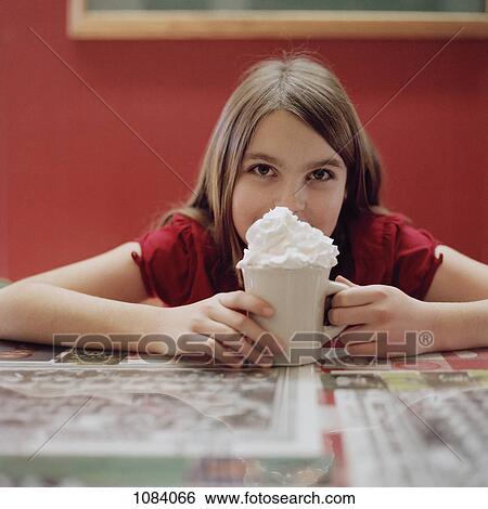 A teenage girl with a mug of hot chocolate View Large Photo Image Stock Photograph - A teenage girl with a mug of hot chocolate. Fotosearch