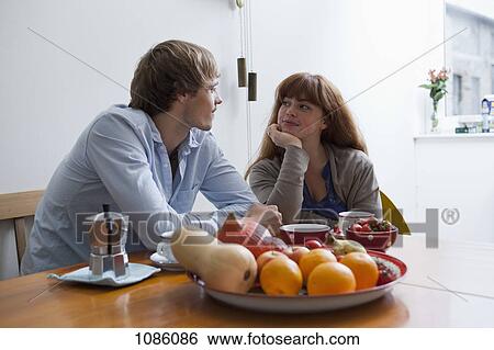 A young couple having breakfast View Large Photo Image Stock Photograph - A young couple having breakfast. Fotosearch