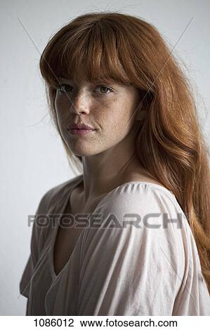 Stock Image - A young woman looking sensually into the camera. Fotosearch