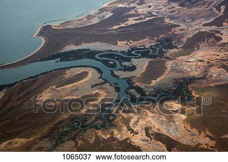 Stock Photo - Aerial view of uncultivated landscape at the coast. Fotosearch