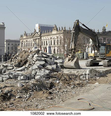 An earth mover and rubble with view of German historical museum (Zeughaus) in the background, View Large Photo Image Stock Image - An earth mover and rubble with view of German historical museum (Zeughaus) in the background, . Fotosearch