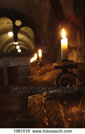 Barrels of wine in cellar lit by candlelight View Large Photo Image Stock Photograph - Barrels of wine in cellar lit by candlelight. Fotosearch