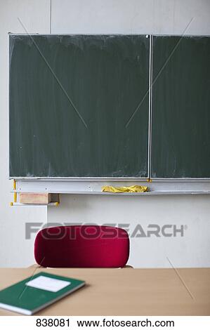 Blackboard behind teachers desk View Large Photo Image Stock Image - Blackboard behind teachers desk. Fotosearch