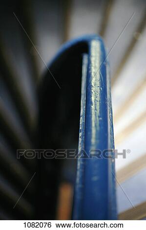 Blue handrail surrounded by spiral staircase View Large Photo Image Stock Photograph - Blue handrail surrounded by spiral staircase. Fotosearch