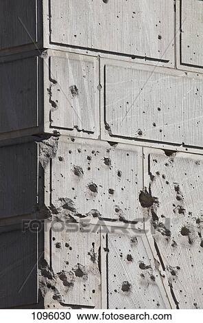 Bullet holes over facade of old building View Large Photo Image Stock Image - Bullet holes over facade of old building. Fotosearch