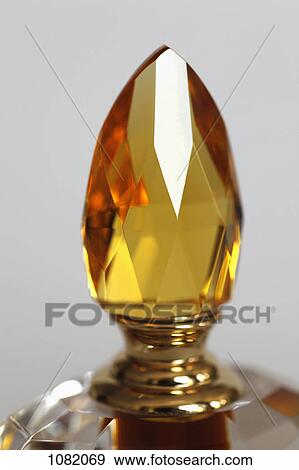 Close-up of the topper on a perfume bottle View Large Photo Image Stock Photo - Close-up of the topper on a perfume bottle. Fotosearch