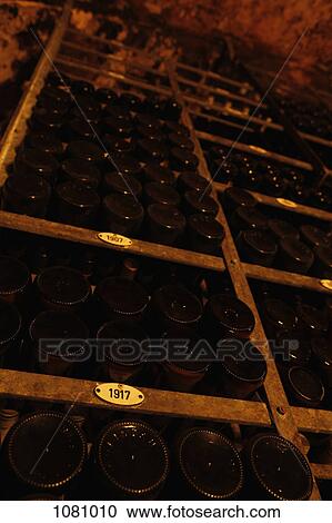 Collection of wine bottles in wine cellar categorized by year View Large Photo Image Stock Image - Collection of wine bottles in wine cellar categorized by year. Fotosearch
