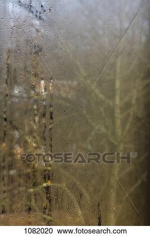Condensation on a window View Large Photo Image Stock Image - Condensation on a window. Fotosearch