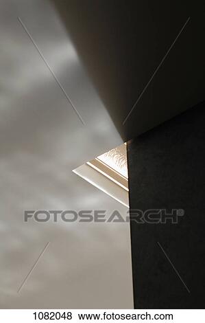 Stock Photo - Corner of skylight surrounded by ceiling and wall. Fotosearch