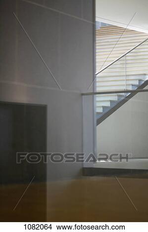 Picture - Corridor, floor and wall viewed through window, making geometric shapes. Fotosearch