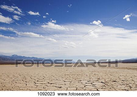 Stock Image - Cracked earth at Death Valley, California. Fotosearch