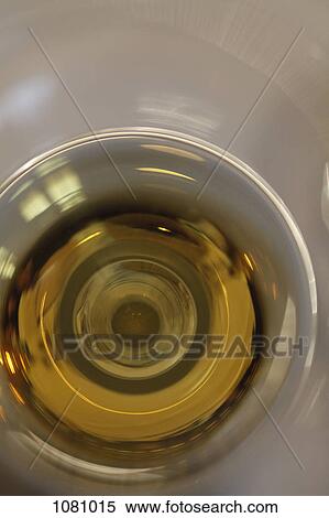 Defocused swirl of a glass of champagne View Large Photo Image Stock Photography - Defocused swirl of a glass of champagne . Fotosearch