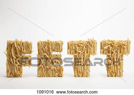 French fries molded to make the word FETT, the German word for fat View Large Photo Image Stock Photograph - French fries molded to make the word FETT, the German word for fat. Fotosearch