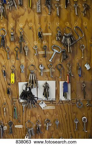 Large collection of keys hanging on hooks View Large Photo Image Stock Image - Large collection of keys hanging on hooks. Fotosearch