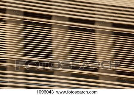 Louvered wooden slats in front of window View Large Photo Image Stock Image - Louvered wooden slats in front of window. Fotosearch