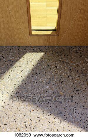 Stock Photo - Marble and wooden floor seen between door. Fotosearch